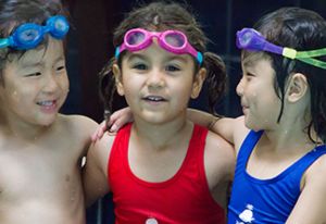 A group of children in swimming suits having fun moment in San Francisco, CA
