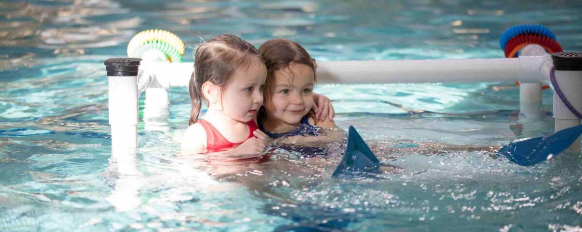 Two little girls learning to swim in San Francisco, CA