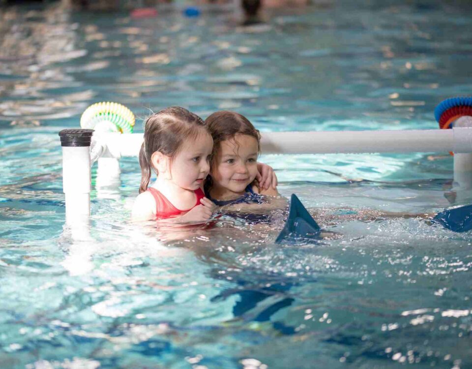 Two little girls learning to swim in San Francisco, CA