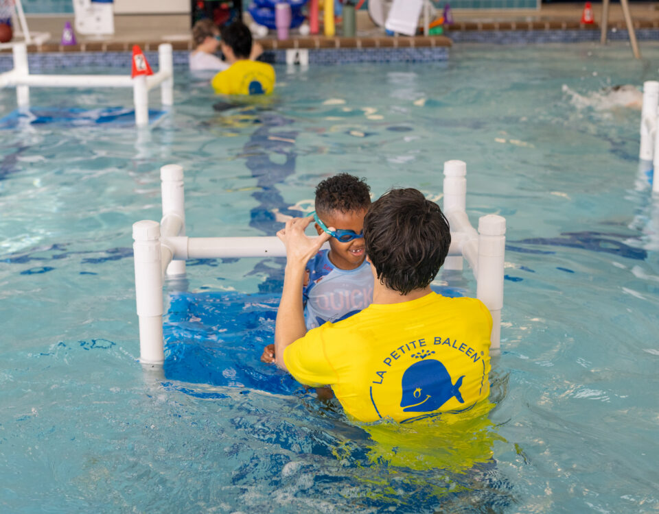 Child learning to swim at La Petite Baleen Rohnert Park in Sonoma County
